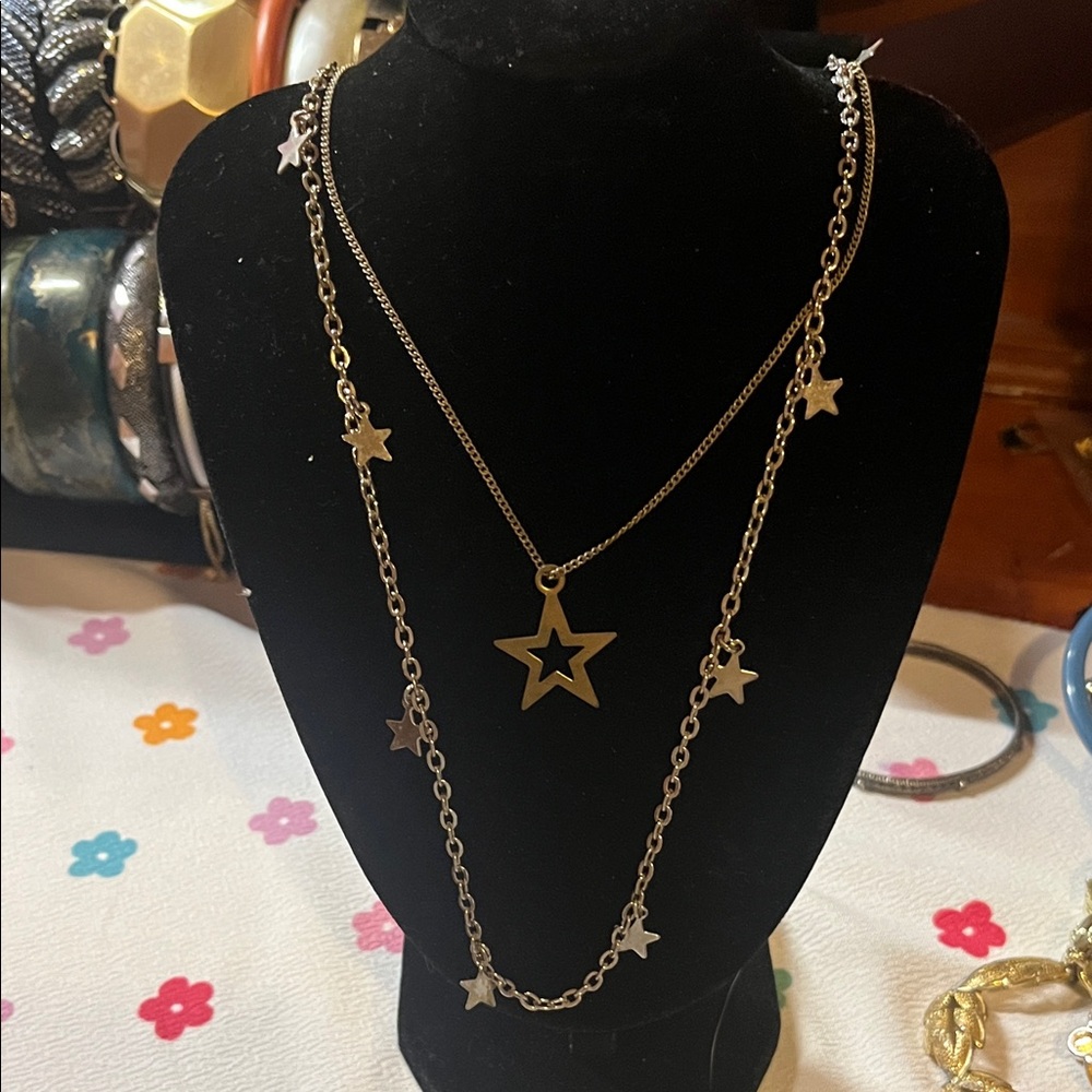 Two Star Charm Necklaces one bronze tone one silver tone